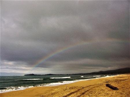 rainbow on the coast of Half Moon Bay State Beach