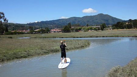 boy paddle boarding